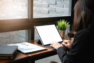Businesswoman working and communicating while sitting at the office desk together.