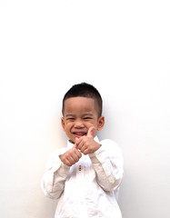 very happy asian boy making thumbs up sign