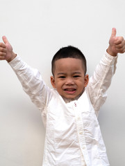 very happy asian boy making thumbs up sign