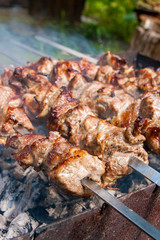 Traditional eastern dish, shish kebab. Roasted meat cooked at barbecue with smoke. .