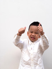 very happy asian boy making thumbs up sign
