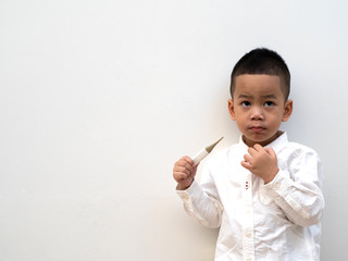 sick boy with thermometer in hand on white background
