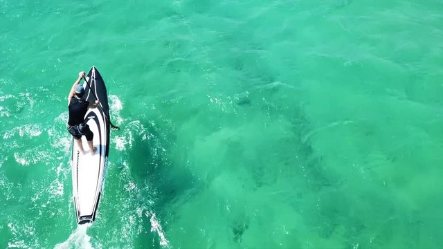Aerial drone video of competition sport paddle surfing or sup in tropical Caribbean sea