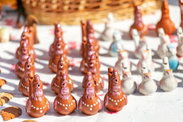 Colorful bird ceramic whistles for sale at handmade market