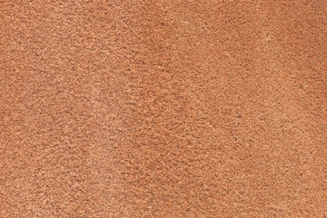 natural texture of red porous stone, close-up. Natural granite texture of rock sandstone pattern in reddish colors for background. stone background. red granite. Brown sand stone wall texture backdrop