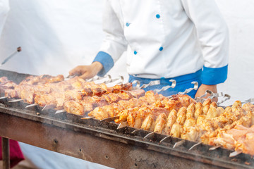The Chef cooking kebab meat on the barbecue