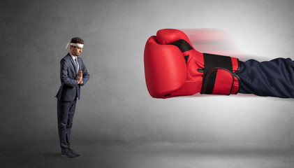 Little man fighting with a giant red boxing glove
