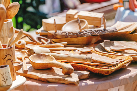 wooden spoons and other kitchen utensils are sale on local market
