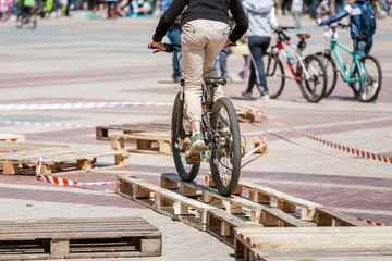 Figure bicycle riding with obstacles