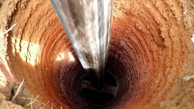 Water Well Drilling, holes boring in ground with drilling rig machine