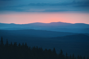 dramatic natural sunset in the wild rocky mountains of the Urals, Russia