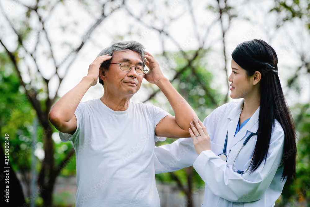 Wall mural Friendly doctor taking care of senior man.