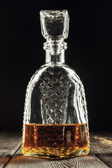 bottle of whiskey, or rum, or alcohol stands