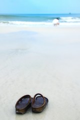 pair of sandals on the beach