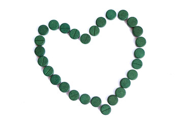 Supplement, spirulina tablets top view.