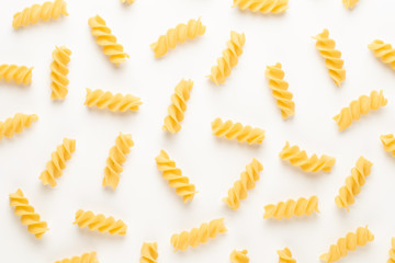 Italian twisted pasta fusilli isolated on white background. Fusilloni, rotini.