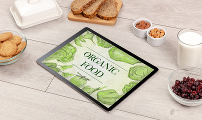 Fresh food on the table with a tablet PC.