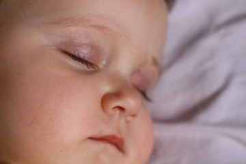 Newborn baby face closeup.