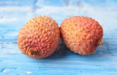 Fresh Lychees on wooden background