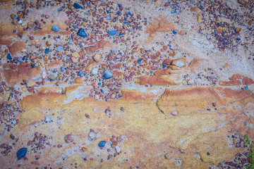 Red shale rock texture background. Shale is a fine-grained, clastic sedimentary rock composed of mud that is a mix of flakes of clay minerals and tiny fragments.