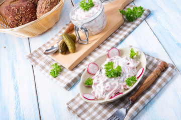 delicious homemade meat salad with mayonnaise and cucumber