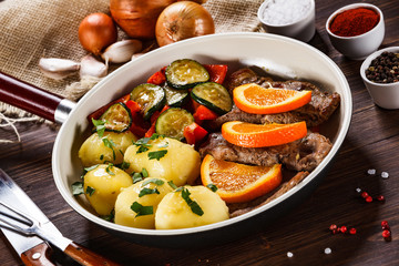 Grilled steak, boiled potatoes and vegetables