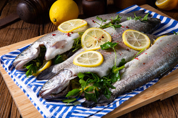 fresh trout with lemon and different herbs