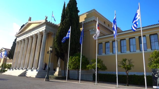 Slow motion video from iconic public Zappeion hall with Greek flag waving, Athens historic center, Attica, Greece