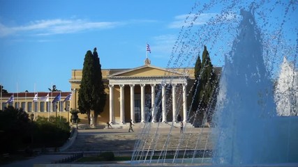 Slow motion video from iconic public Zappeion hall with Greek flag waving, Athens historic center, Attica, Greece