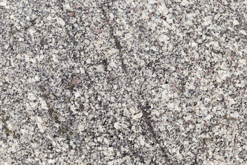 Marble texture with different colored spots. The surface of granite stone with streaks, spots and patterns of different colors. Visible stone texture with thick lines and mottled spots. 