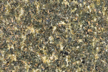 Marble texture with different colored spots. The surface of granite stone with streaks, spots and patterns of different colors. Visible stone texture with thick lines and mottled spots. 