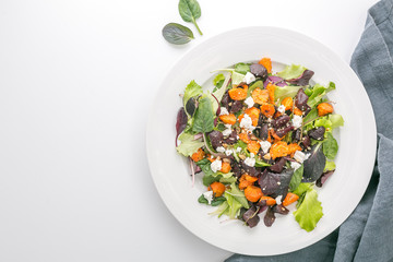 Baked beet and carrot salad with cheese. top view. flat lay. copy space