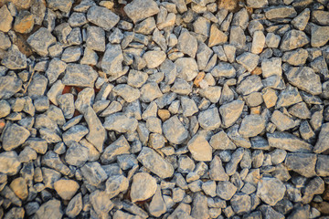 Small stone gravel background texture. Gravel texture for background. Crushed stones on the railway for texture and background