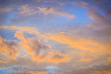 Red cloud and blue sky background. Dramatic sunset sky began to change from blue to orange.