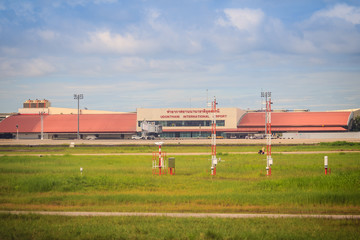 Terminal building on grass field of Udon Thani International Airport (UTH), located near the city of Udon Thani Province in the northeast region of Thailand.