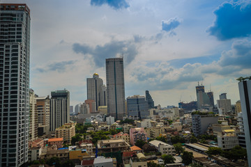 High-rise buildings of hotel and condominium against blue sky background in Bangkok, Thailand.