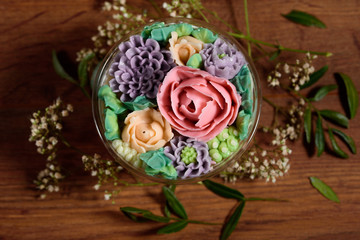 Delicious, appetizing, fragrant dessert. Triple delicious light dessert, decorated with oil flowers.
