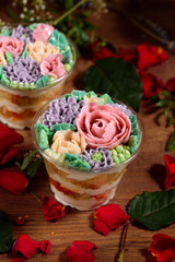 Delicious, appetizing, fragrant dessert. Triple delicious light dessert, decorated with oil flowers.