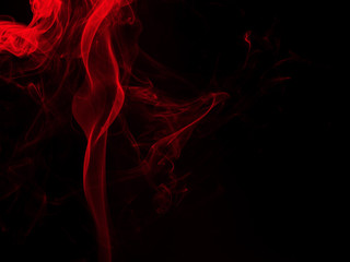 Obraz premium Red smoke abstract on black background. fire design, darkness concept