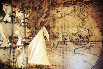 Old pirate sailboat, ship model,cannons,world map.Travel and marine engraving background. Retro style.Treasure hood concept.