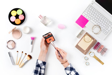 Beauty blogger with makeup cosmetics.