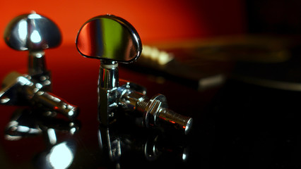 guitar tuning pegs and guitar . closeup
