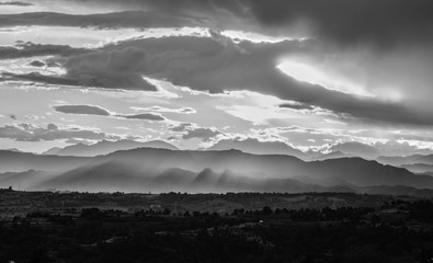 Black and white cloudy and misty sunset