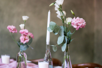 Wedding banquet. table for guests, decorated with candles, served with cutlery and crockery and covered with a tablecloth.