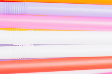 Close up to colorful straws background