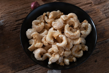 Pork rinds also known as chicharon or chicharrones , kab moo