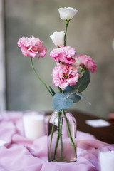 delicate, wedding decor of the table in powder shades and with floral compositions. wedding bouquet and wedding details