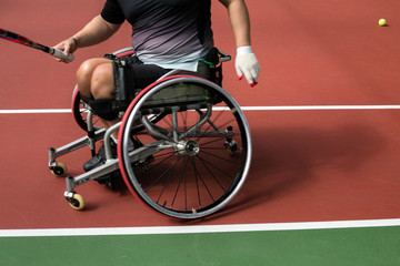 People with disabilities in a wheelchair playing tennis at the Paralympics