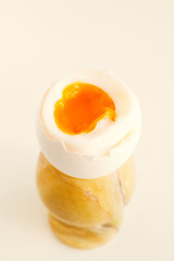 Soft boiled egg in egg-glass. Selective focus.