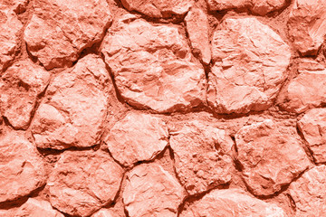 Texture of stone wall clored in living coral.
